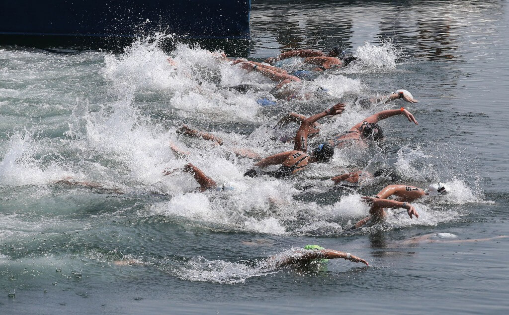 Jul 11, 2015; Toronto, Ontario, CAN; The swimmers dive into Lake Ontario to begin the women's 10km open water swimming competition during the 2015 Pan Am Games at Ontario Place West Channel. Mandatory Credit: Tom Szczerbowski-USA TODAY Sports