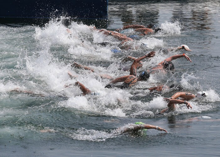 Jul 11, 2015; Toronto, Ontario, CAN; The swimmers dive into Lake Ontario to begin the women's 10km open water swimming competition during the 2015 Pan Am Games at Ontario Place West Channel. Mandatory Credit: Tom Szczerbowski-USA TODAY Sports