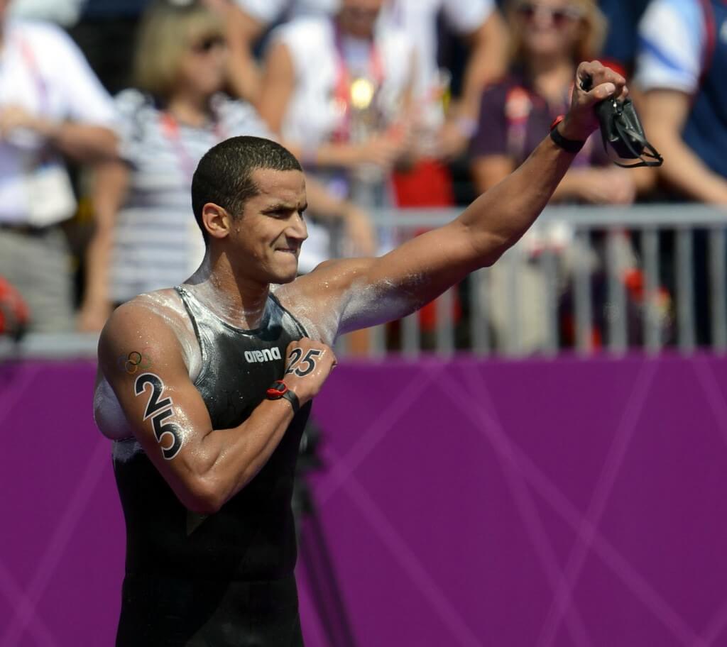 Aug 10, 2012; London, United Kingdom; Tunisia swimmer Oussama Mellouli celebrates after winning the men's open water 10km swim during the London 2012 Olympic Games at Hyde Park. Mandatory Credit: Andrew P. Scott-USA TODAY Sports