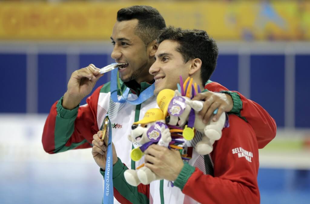 Jul 11, 2015; Toronto, Ontario, CAN; Jahir Ocampo (left) and Rommel Pacheco (right) of Mexico pose with their medals after the men's 3m springboard diving final during the 2015 Pan Am Games at Pan Am Aquatics UTS Centre and Field House. Mandatory Credit: Erich Schlegel-USA TODAY Sports