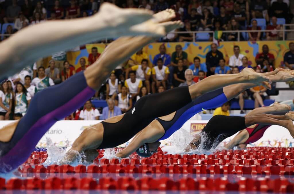 Jul 17, 2015; Toronto, Ontario, CAN; Liliana Ibanez of Mexico dives into the pool at the start of the women's 50m freestyle B final the 2015 Pan Am Games at Pan Am Aquatics UTS Centre and Field House. Mandatory Credit: Rob Schumacher-USA TODAY Sports