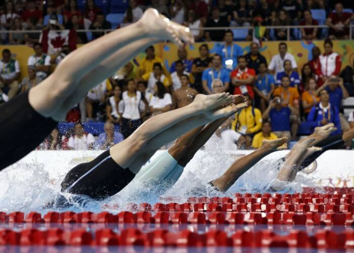 Jul 17, 2015; Toronto, Ontario, CAN; A view of the feet of the competitors as they dive in at the start of the women's 50m freestyle final the 2015 Pan Am Games at Pan Am Aquatics UTS Centre and Field House. Mandatory Credit: Rob Schumacher-USA TODAY Sports