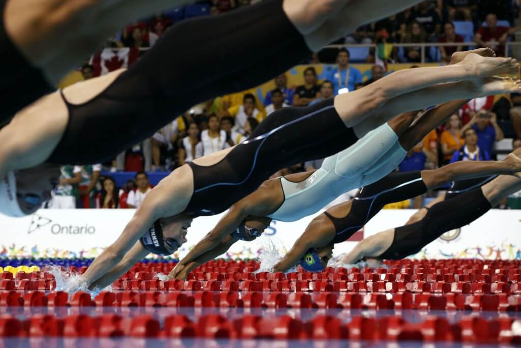 Jul 17, 2015; Toronto, Ontario, CAN; Arianna Vanderpool-Wallace of the Bahamas dives into the pool at the start of the women's 50m freestyle final the 2015 Pan Am Games at Pan Am Aquatics UTS Centre and Field House. Mandatory Credit: Rob Schumacher-USA TODAY Sports