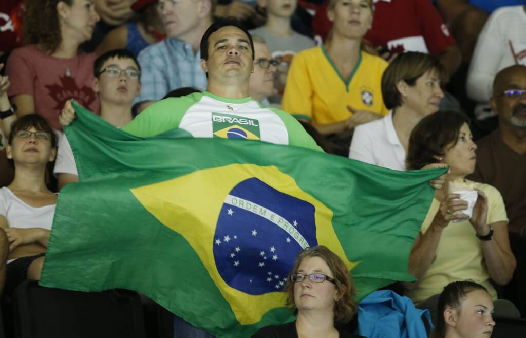 Jul 17, 2015; Toronto, Ontario, CAN; A fan of Brazil waves a flag during the medal ceremony for the women's swimming 400m individual medley final the 2015 Pan Am Games at Pan Am Aquatics UTS Centre and Field House. Mandatory Credit: Erich Schlegel-USA TODAY Sports