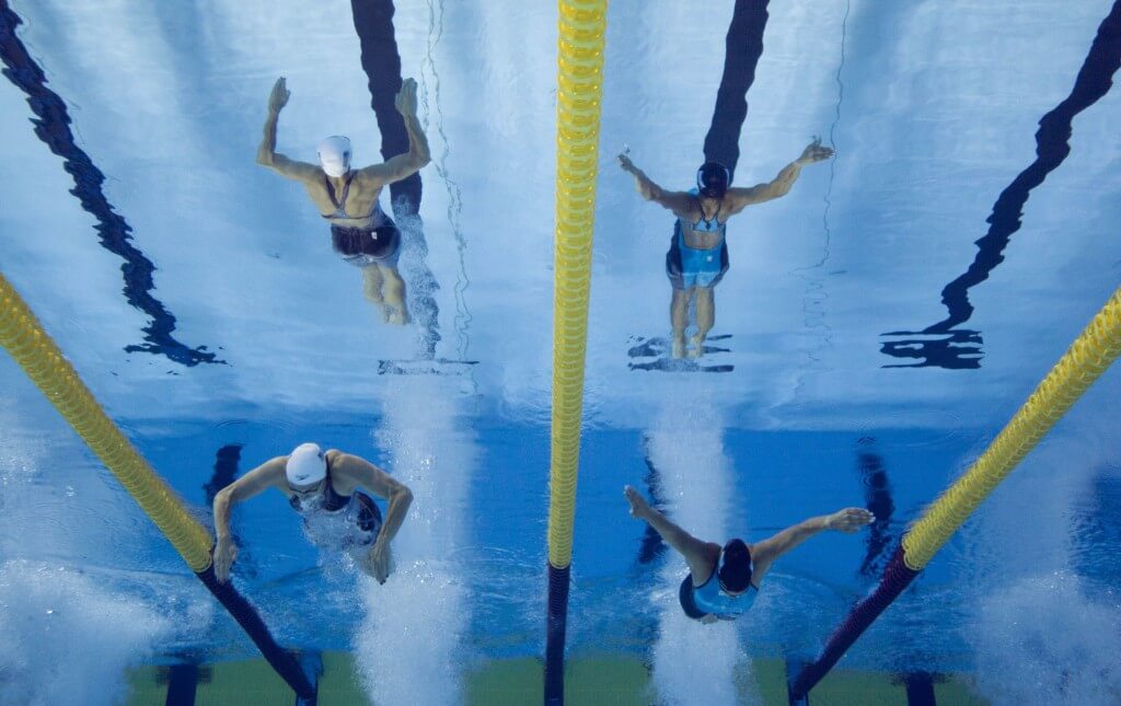 Jul 17, 2015; Toronto, Ontario, CAN; Katie Meili of the United States (left) races Julia Sebastian of Argentina (right) in the women's swimming 100m breaststroke preliminary heats during the 2015 Pan Am Games at Pan Am Aquatics UTS Centre and Field House. Mandatory Credit: Erich Schlegel-USA TODAY Sports