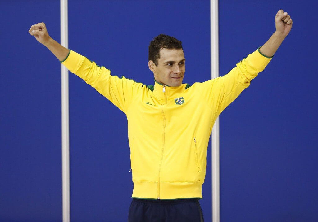 Jul 14, 2015; Toronto, Ontario, CAN; Leonardo De Deus of Brazil celebrates on the podium after winning the men's 200m butterfly swimming final during the 2015 Pan Am Games at Pan Am Aquatics UTS Centre and Field House. Mandatory Credit: Rob Schumacher-USA TODAY Sports