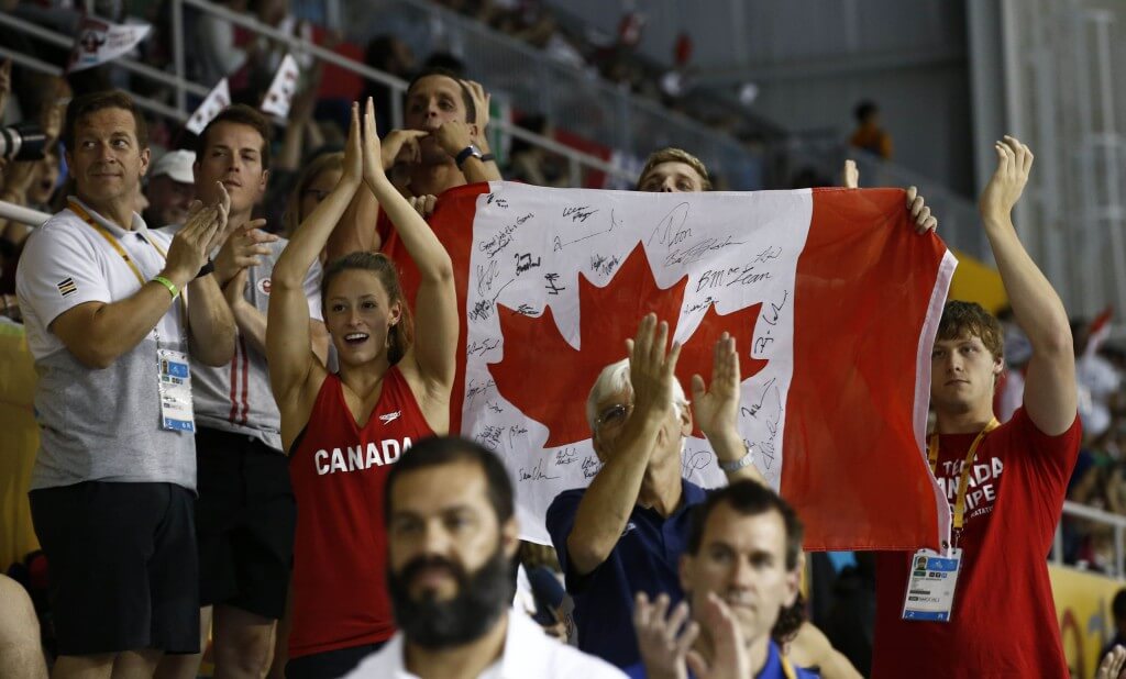 Jul 17, 2015; Toronto, Ontario, CAN; Canada swim team members cheer at the medal ceremony for the women's swimming 400m individual medley final the 2015 Pan Am Games at Pan Am Aquatics UTS Centre and Field House. Mandatory Credit: Rob Schumacher-USA TODAY Sports