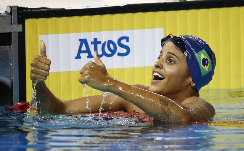 Jul 17, 2015; Toronto, Ontario, CAN; Etiene Medeiros of Brazil celebrates after winning the women's 100m backstroke final the 2015 Pan Am Games at Pan Am Aquatics UTS Centre and Field House. Mandatory Credit: Rob Schumacher-USA TODAY Sports