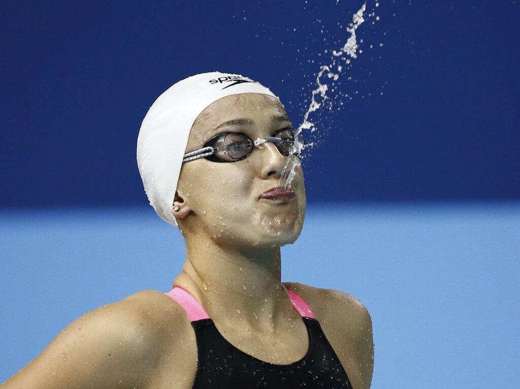 Jul 14, 2015; Toronto, Ontario, CAN; Larissa Martins of Brazil spits out a mouthful of water before the women's 100m freestyle swimming final during the 2015 Pan Am Games at Pan Am Aquatics UTS Centre and Field House. Mandatory Credit: Rob Schumacher-USA TODAY Sports