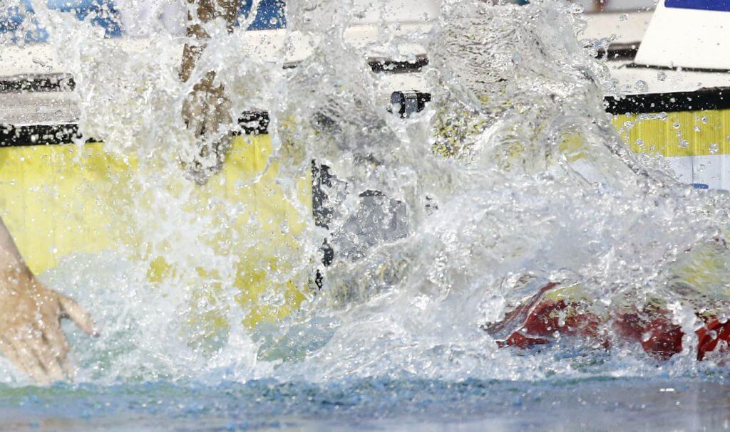 Jul 14, 2015; Toronto, Ontario, CAN; Santo Condorelli of Canada splashes water on himself before the men's 100m freestyle swimming final during the 2015 Pan Am Games at Pan Am Aquatics UTS Centre and Field House. Mandatory Credit: Rob Schumacher-USA TODAY Sports