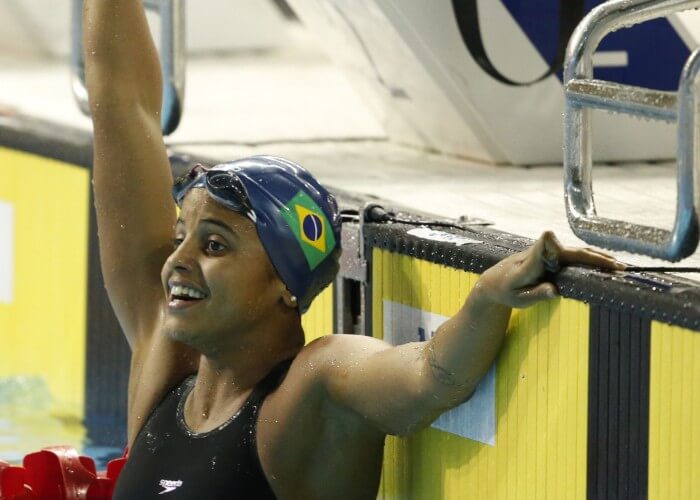 Jul 17, 2015; Toronto, Ontario, CAN; Etiene Medeiros of Brazil celebrates after winning the women's 100m backstroke final the 2015 Pan Am Games at Pan Am Aquatics UTS Centre and Field House. Mandatory Credit: Erich Schlegel-USA TODAY Sports