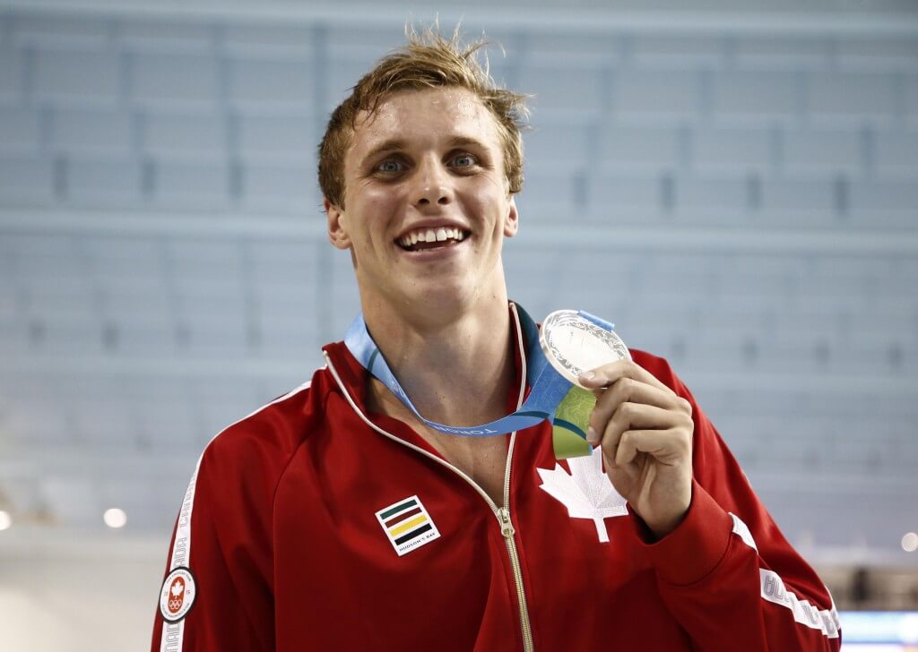 Jul 14, 2015; Toronto, Ontario, CAN; Santo Condorelli of Canada poses with his silver medal after the men's 100m freestyle swimming final during the 2015 Pan Am Games at Pan Am Aquatics UTS Centre and Field House. Mandatory Credit: Rob Schumacher-USA TODAY Sports