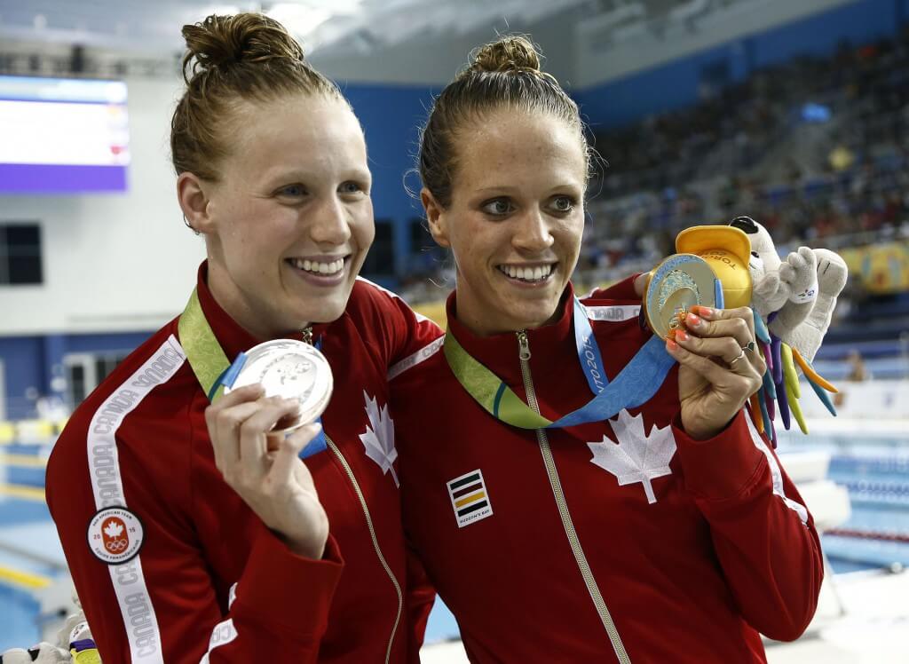 Jul 15, 2015; Toronto, Ontario, CAN; Dominique Bouchard and Hilary Caldwell of Canada celebrates winning the gold and silver in the women’s 200m backstroke final during the 2015 Pan Am Games at Pan Am Aquatics UTS Centre and Field House. Mandatory Credit: Rob Schumacher-USA TODAY Sports
