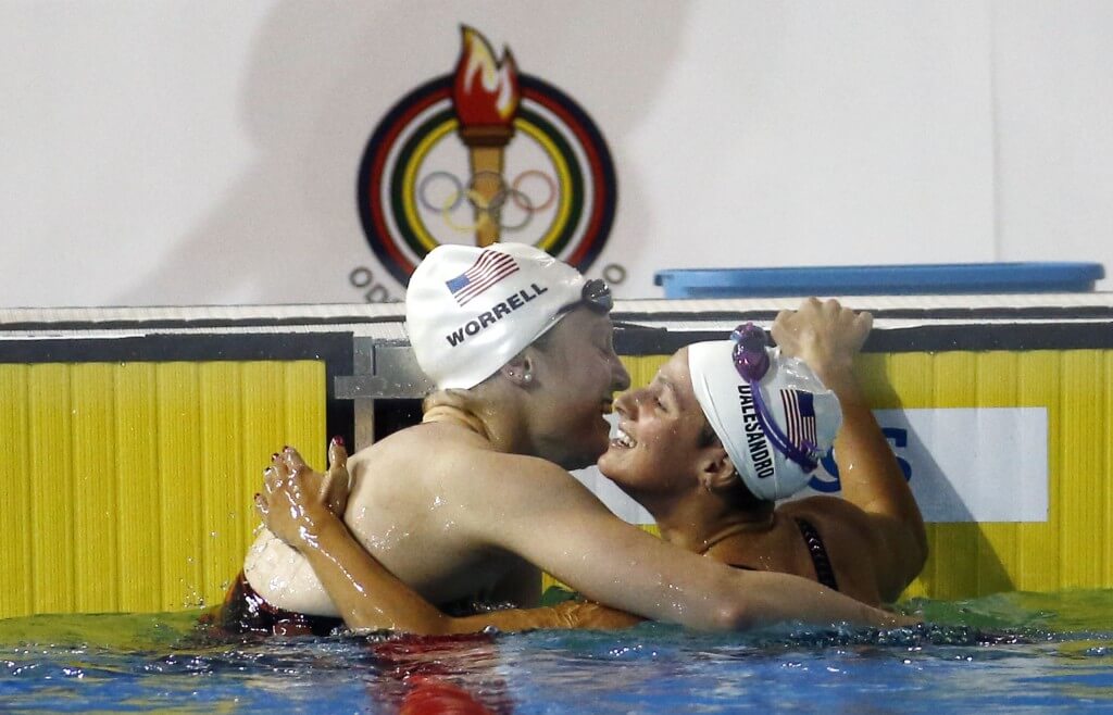 Jul 16, 2015; Toronto, Ontario, CAN; Kelsi Worrell of the United States (left) hugs Gia Dalesandro of the United States after the women's swimming 100m butterfly preliminary heats during the 2015 Pan Am Games at Pan Am Aquatics UTS Centre and Field House. Mandatory Credit: Rob Schumacher-USA TODAY Sports