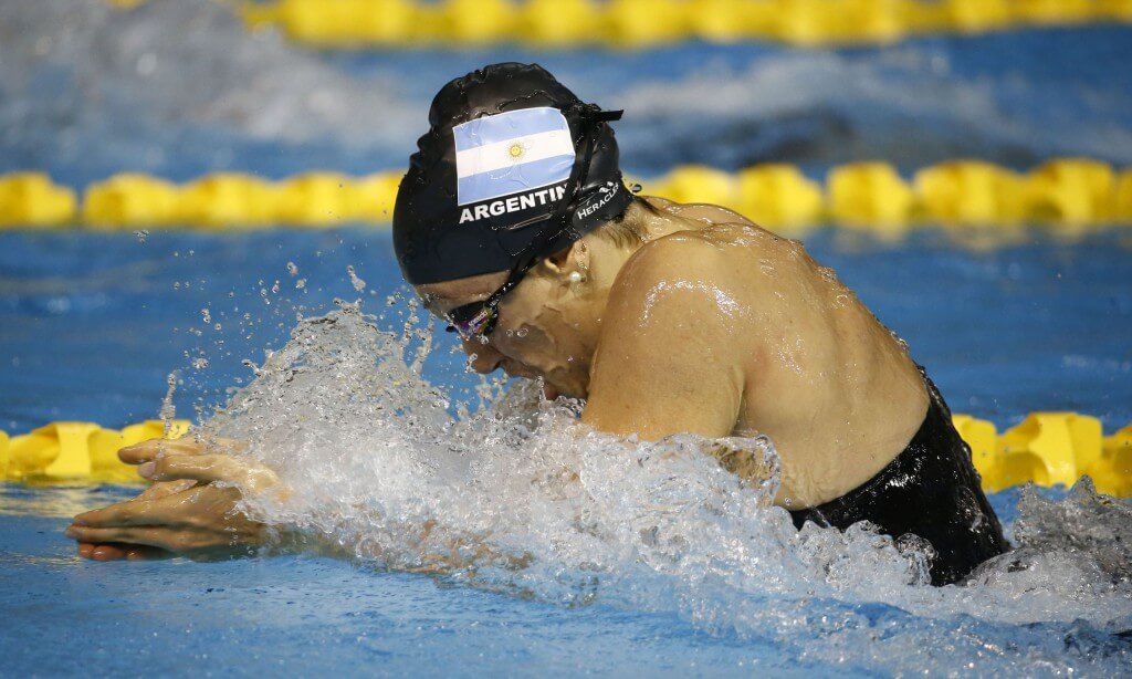 Jul 17, 2015; Toronto, Ontario, CAN; Macarena Ceballos of Argentina competes in the women's swimming 100m breaststroke preliminary heats during the 2015 Pan Am Games at Pan Am Aquatics UTS Centre and Field House. Mandatory Credit: Rob Schumacher-USA TODAY Sports