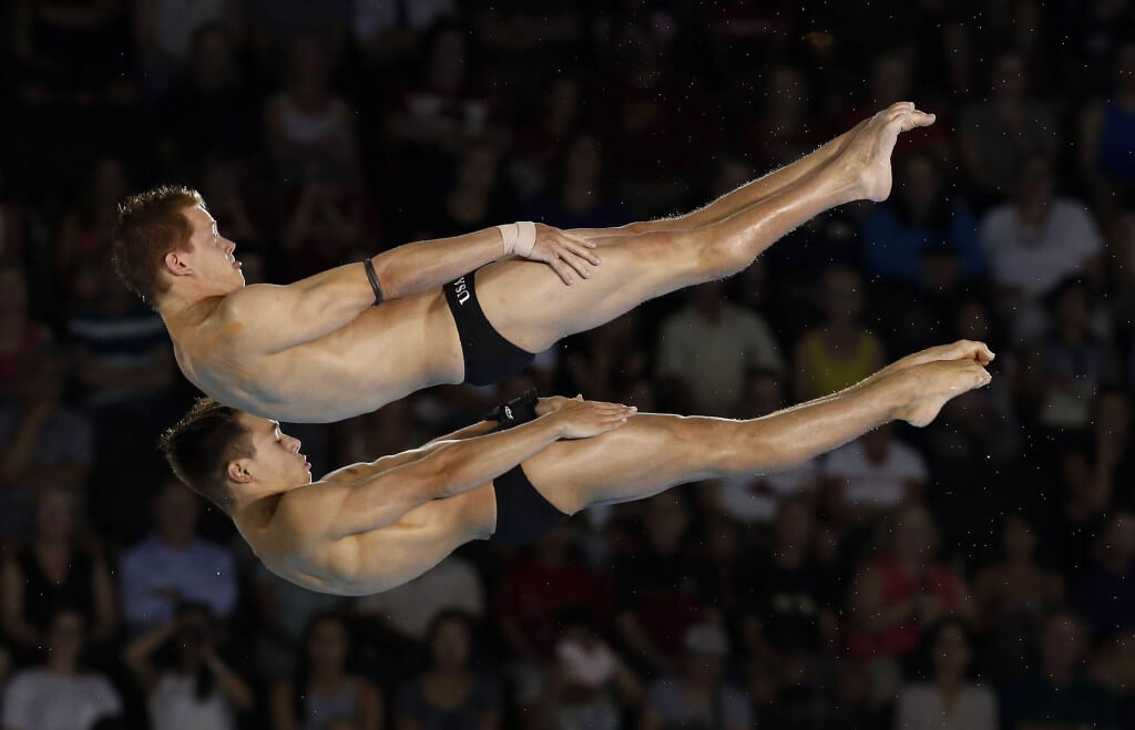 Jul 13, 2015; Toronto, Ontario, USA; Zachary Cooper and Ryan Hawkins of the United States compete in the men's synchronized 10m platform final during the 2015 Pan Am Games at Pan Am Aquatics UTS Centre and Field House. Mandatory Credit: Rob Schumacher-USA TODAY Sports