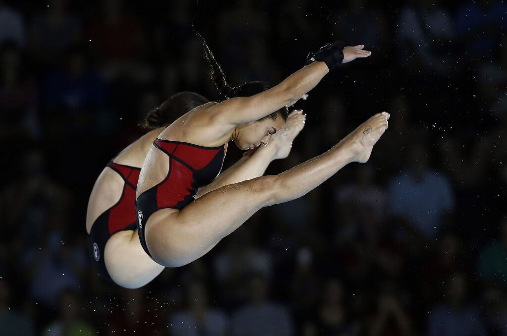 Jul 13, 2015; Toronto, Ontario, USA; Meaghan Benfeito and Roseline Filion of Canada compete in the women's synchronized 10m platform final during the 2015 Pan Am Games at Pan Am Aquatics UTS Centre and Field House. Mandatory Credit: Rob Schumacher-USA TODAY Sports