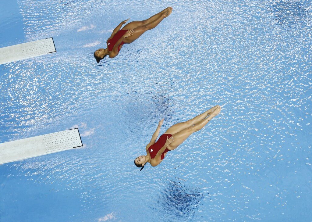 Jul 13, 2015; Toronto, Ontario, USA; Pamela Ware and Jennifer Abel of Canada compete in the women's synchronised diving 3m springboard final the 2015 Pan Am Games at Pan Am Aquatics UTS Centre and Field House. Mandatory Credit: Rob Schumacher-USA TODAY Sports