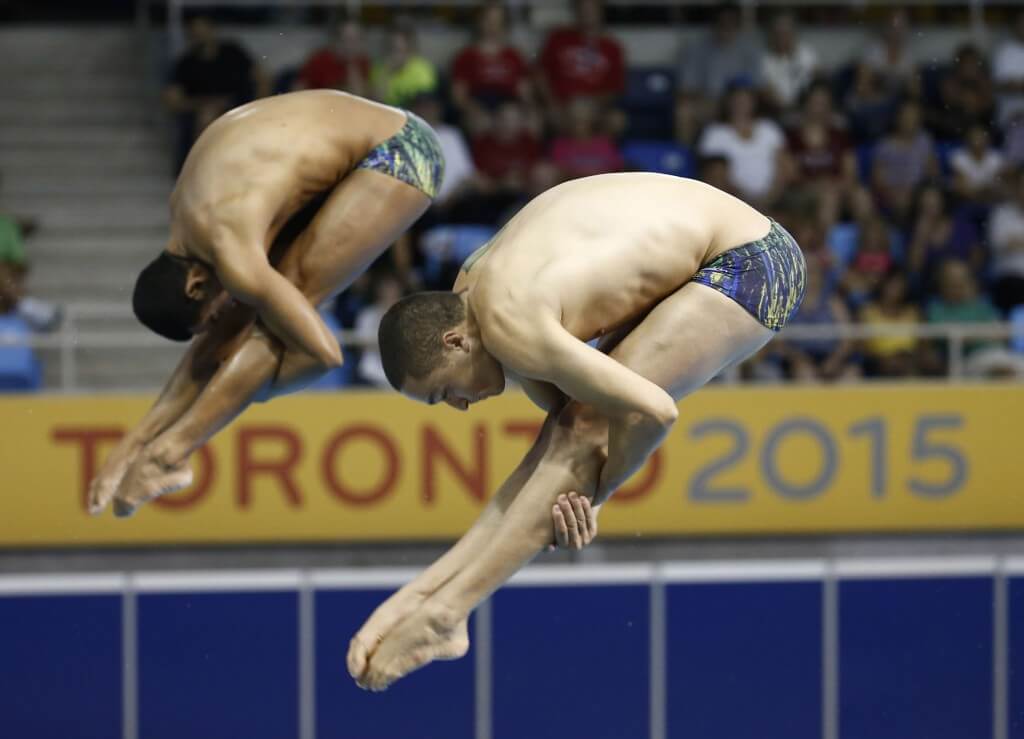 Jul 13, 2015; Toronto, Ontario, USA; Ian Matos and Cesar Castro of Brazil compete in the men's synchronised diving 3m springboard final the 2015 Pan Am Games at Pan Am Aquatics UTS Centre and Field House. Mandatory Credit: Rob Schumacher-USA TODAY Sports