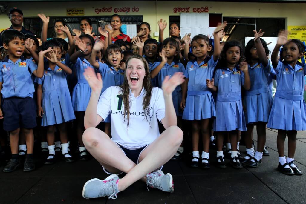 SEENIGAMA, SRI LANKA-OCTOBER 6, 2015: Laureus Ambassador and Olympic gold medalist Missy Franklin poses a picture with children at Foundation of Goodness during the Missy Franklin Sri Lanka Project Visit on October 6, 2015 in Seenegama, Sri Lanka. (Photo by Buddhika Weerasinghe/Laureus/Getty Images)