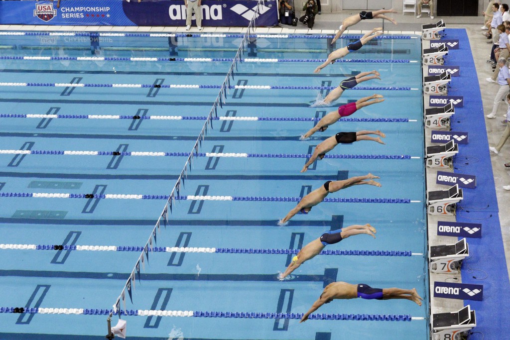 Jan 16, 2016; Austin, TX, USA; Swimmers dive in the men's 400 meter IM final during the 2016 Arena Pro Swim Series at Lee & Joe Jamail Texas Swimming Center. Mandatory Credit: Soobum Im-USA TODAY Sports