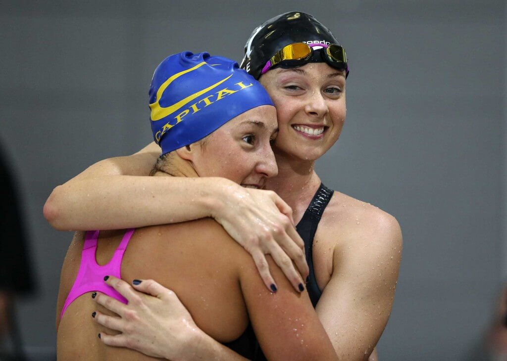Lauren Boyle (R) and Emma Robinson embrace after qualifying for the Rio Olympics in the 800m freestyle during the New Zealand Open Swimming Championships, Owen G Glenn National Aquatic Centre, Auckland, New Zealand. Monday 28 March 2016 Photo: Simon Watts / www.bwmedia.co.nz
