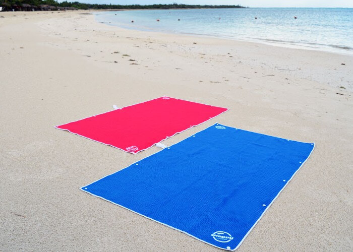 Swim towels on the beach. Snaps along each side of the towel allow you to wear and hang them in many convenient ways.