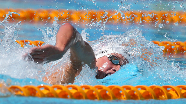 U.S. Jordan Wilimovsky swims during his men's 1500-meter freestyle timed final at the Pan Pacific swimming championships in Gold Coast, Australia, Thursday, Aug. 21, 2014. (AP Photo/Rick Rycroft)