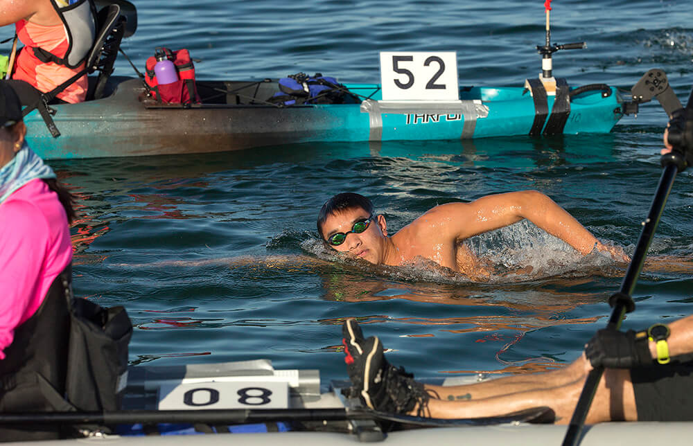 Noah Zhang, 17, strokes his way to victory in the open-water Swim for Alligator Lighthouse Saturday, Sept. 17, 2016, off Islamorada, Fla. Zhang completed the 9-mile-long ocean swim in 3 hours and 46 minutes. The competition attracted 181 contestants and was staged to create awareness of a need to preserve Alligator Lighthouse and five more historic lighthouses off the Florida Keys. Each lighthouse is more than 130 years old and no longer maintained because of modern advances in maritime navigation. (Bob Care/Florida Keys News Bureau via AP)