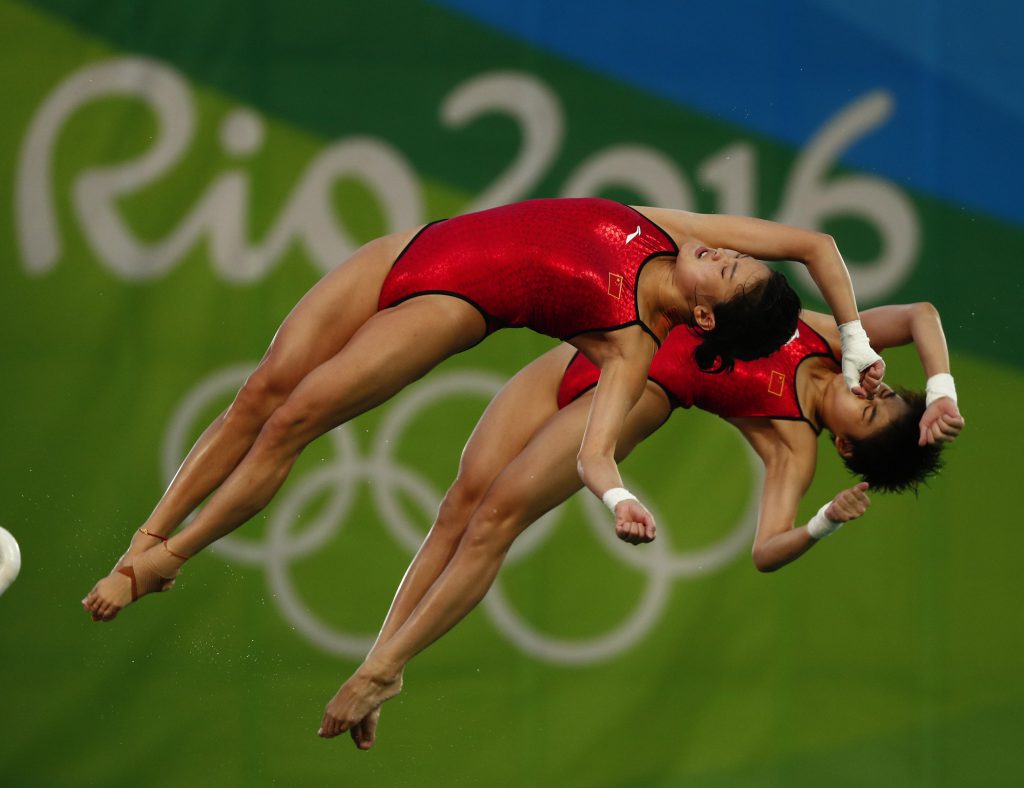 Aug 9, 2016; Rio de Janeiro, Brazil; Ruolin Chen and Huixia Liu (CHN) during the women's 10m platform synchronized diving final in the Rio 2016 Summer Olympic Games at Maria Lenk Aquatics Centre. Mandatory Credit: Andrew P. Scott-USA TODAY Sports