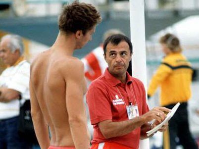 Canada's Alex Baumann (left) and his coach Jeno Tehanyi at the 1984 Olympic games in Los Angeles. (CP PHOTO/ COA/Ted Grant ) Alex Baumann et l'entraîneur Jeno Tehanyi du Canada participent aux compétitions de natation aux Jeux olympiques de Los Angeles de 1984. (PC Photo/AOC)