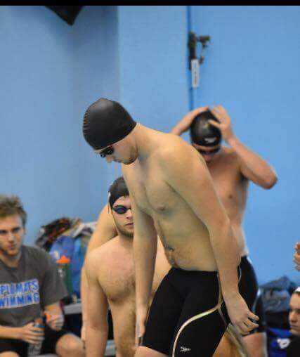male-swimmer-on-blocks-pre-race
