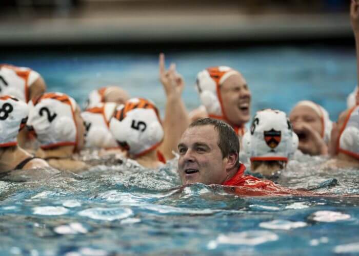 Princeton head coach Luis Nicolao celebrates winning the CWPA Final in the pool with his players on Sunday, April 28. Daniel Brenner I AnnArbor.com