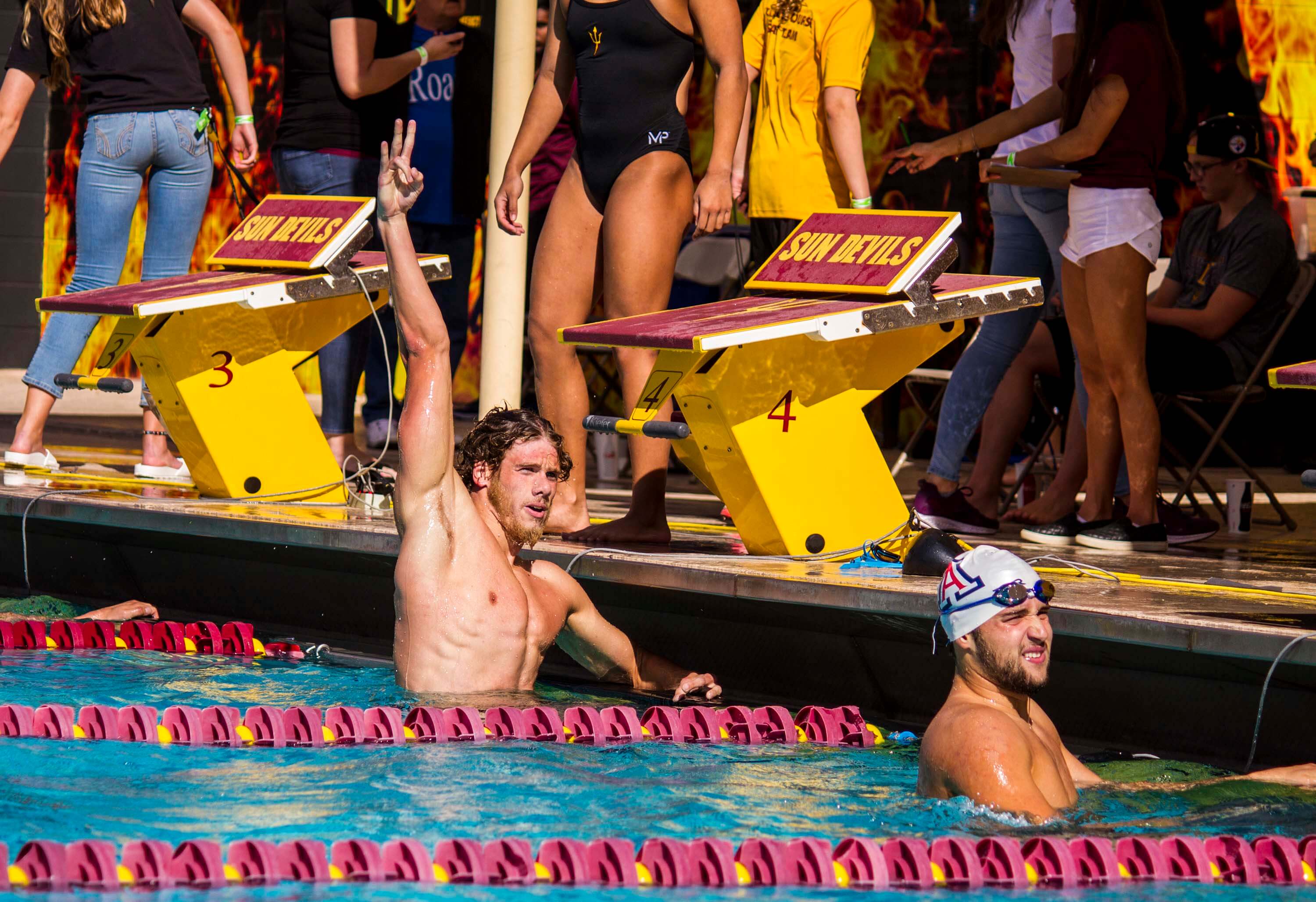 Arizona State University sophomore Cameron Craig rasies a fork after dominating the 200 yard freestyle for ASU’s first individual victory of the day during of ASU’s dual meet victory over the No. 18 Arizona Wildcats at Mona Plummer Aquatic Center on Saturday, February 3, 2018 in Tempe, AZ. (Photo by Blake Benard)