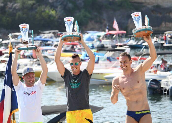 Blake Aldridge (L) of the UK, Kris Kolanus (C) of Poland and Michal Navratil of the Czech Republic celebrate on the podium during the final competition day of the first stop at the Red Bull Cliff Diving World Series in Possum Kingdom Lake, Texas, USA on June 2, 2018. // Romina Amato/Red Bull Content Pool // AP-1VUX71C692111 // Usage for editorial use only // Please go to www.redbullcontentpool.com for further information. //