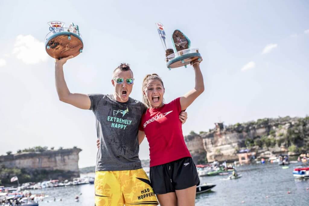 Kris Kolanus (L) of Poland and Adriana Jimenez of Mexico celebrate on the podium during the final competition day of the first stop at the Red Bull Cliff Diving World Series in Possum Kingdom Lake, Texas, USA on June 2, 2018. // Dean Treml/Red Bull Content Pool // AP-1VUWXUWMH2111 // Usage for editorial use only // Please go to www.redbullcontentpool.com for further information. //