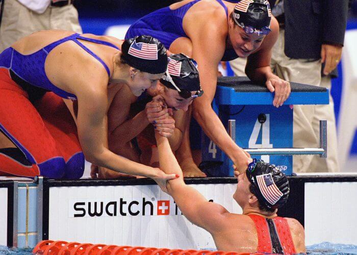 20 Sep 2000: Samantha Arsenault, Diana Munz, Lindsay Benko and Jenny Thompson of the USA celebrate their Gold Medal win in the Womens 4 x 200m Freestyle Relay Final at the Sydney International Aquatic Centre on Day Five of the Sydney 2000 Olympic Gamesin Sydney, Australia. Mandatory Credit: Nick Wilson /Allsport