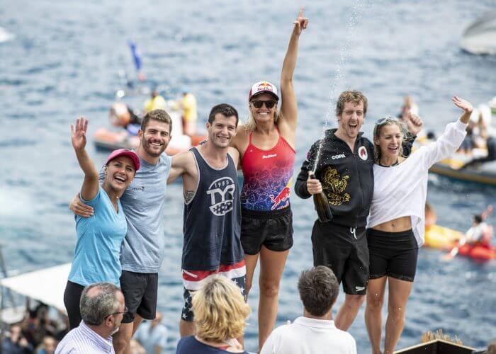 (L-R) Adriana Jimenez of Mexico, David Colturi and Steven LoBue of the USA, Rhiannan Iffland of Australia, Gary Hunt of the UK and Lysanne Richard of Canada celebrate on the podium at Islet Vila Franca do Campo during the final competition day of the third stop at the Red Bull Cliff Diving World Series in Azores, Portugal on July 14, 2018. // Dean Treml/Red Bull Content Pool // AP-1W9C2PQJ52111 // Usage for editorial use only // Please go to www.redbullcontentpool.com for further information. //