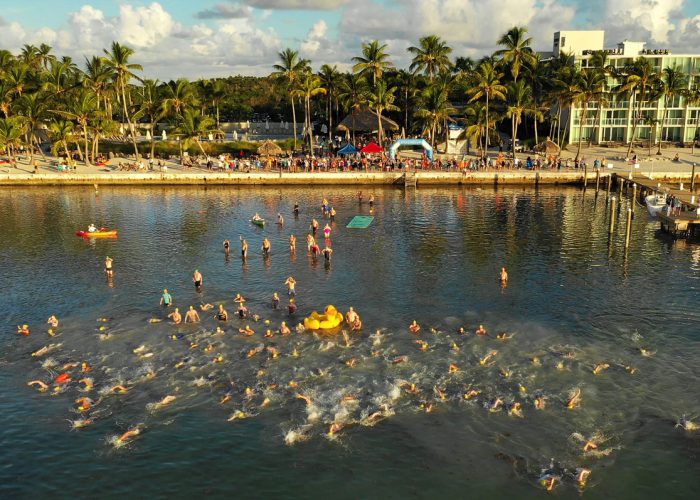 A portion of a field of more than 350 swimmers begins the "Swim for Alligator Lighthouse Saturday, Sept. 15, 2018, off Islamorada, Fla. Entrants, divided into single and group divisions, navigated an 8-mile open water swimming course from the Amara Cay Resort in the Florida Keys to Alligator Reef Lighthouse and back. FOR EDITORIAL USE ONLY (Bob Care/Florida Keys News Bureau/HO)