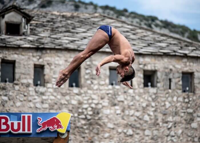 Jonathan Paredes of Mexico dives from the 27 metre platform on Stari Most during the first competition day of the sixth stop at the Red Bull Cliff Diving World Series in Mostar, Bosnia and Herzegovina on September 7, 2018. // Dean Treml/Red Bull Content Pool // AP-1WTZX9VDH2111 // Usage for editorial use only // Please go to www.redbullcontentpool.com for further information. //