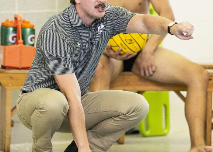 Oct 14, 2018; Baltimore, MD, USA; Monmouth Fighting Scots head coach Peter Ollis directs his team against the Austin College 'Roos at the Newton White Athletic Center Natatorium. Greg Bartram/betterImage
