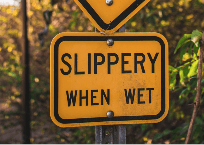 slippery-when-wet-sign-struggle