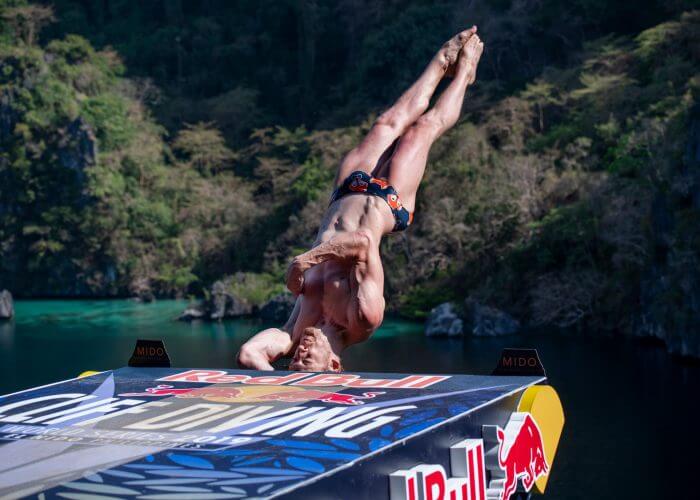 Gary Hunt of the UK dives from the 27 metre platform at the Big Lagoon on Miniloc Island during the final competition day of the first stop of the Red Bull Cliff Diving World Series in Palawan, Philippines on April 13, 2019. // Dean Treml/Red Bull Content Pool // AP-1Z16H9ZGD1W11 // Usage for editorial use only // Please go to www.redbullcontentpool.com for further information. //