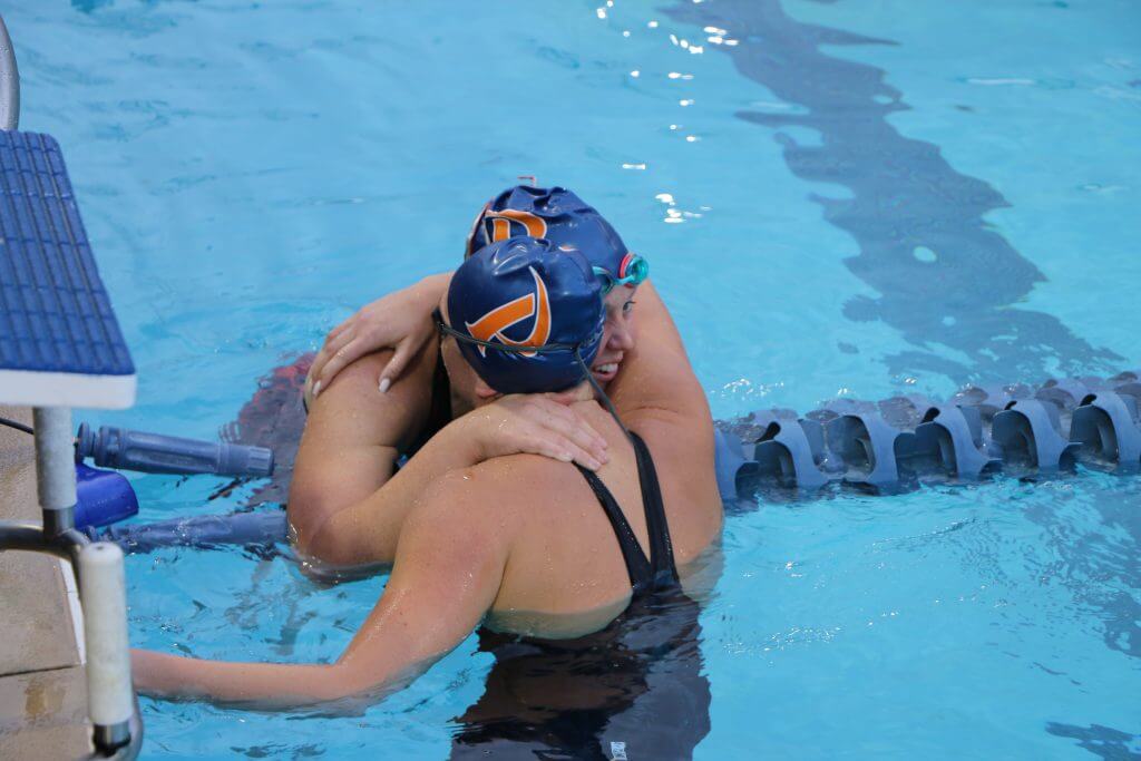 teammates-swim-meet-championship-post-race-hug-