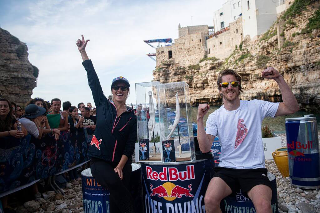 Rhiannan Iffland of Australia and Gary Hunt of the UK celebrate after winning the third stop of the Red Bull Cliff Diving World Series in Polignano a Mare, Italy on June 2, 2019. // Romina Amato/Red Bull Content Pool // AP-1ZHA82MD92111 // Usage for editorial use only // Please go to www.redbullcontentpool.com for further information. //