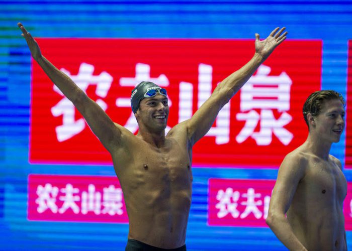 Gregorio Paltrinieri of Italy celebrates on his way out after winning in the men's 800m Freestyle Final during the Swimming events at the Gwangju 2019 FINA World Championships, Gwangju, South Korea, 24 July 2019. Henrik Christiansen of Norway (R) finishes second.