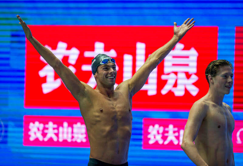 Gregorio Paltrinieri of Italy celebrates on his way out after winning in the men's 800m Freestyle Final during the Swimming events at the Gwangju 2019 FINA World Championships, Gwangju, South Korea, 24 July 2019. Henrik Christiansen of Norway (R) finishes second.