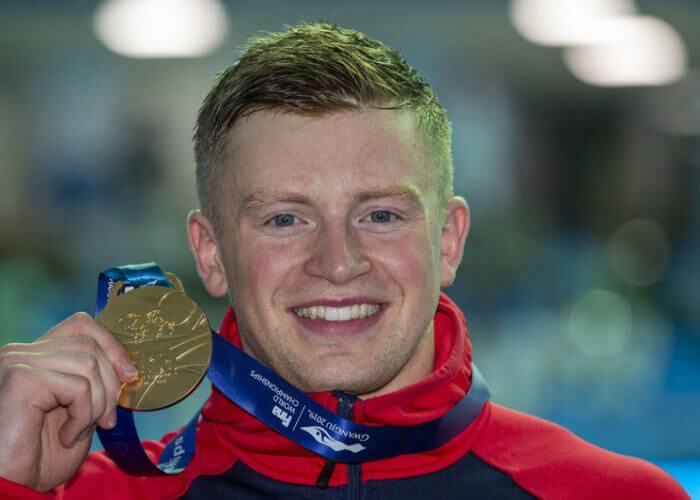 Adam Peaty of Great Britain poses with his Gold medal after winning in the men's 100m Breaststroke Final during the Swimming events at the Gwangju 2019 FINA World Championships, Gwangju, South Korea, 22 July 2019.