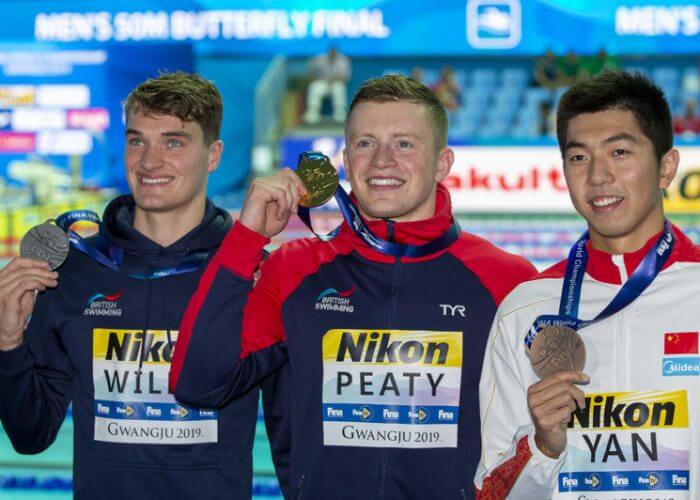 (L-R) Second placed James Wilby of Great Britain, winner Adam Peaty of Great Britain and third placed Zibei Yan of China pose with their medals after competing in the men's 100m Breaststroke Final during the Swimming events at the Gwangju 2019 FINA World Championships, Gwangju, South Korea, 22 July 2019.