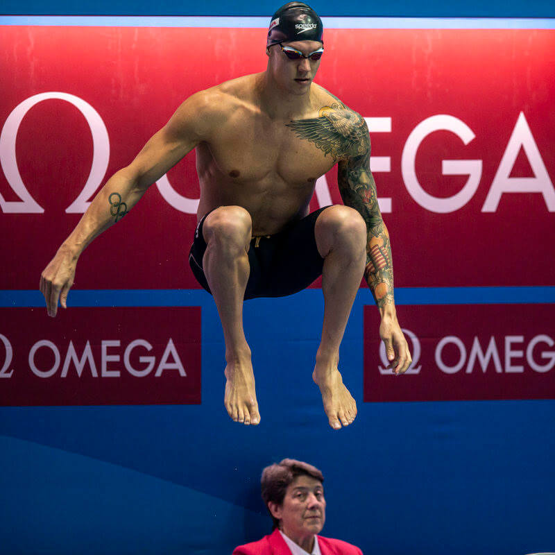 Caeleb Dressel of the United States of America (USA) jumps in the air before competing in the men's 50m Freestyle Semifinal during the Swimming events at the Gwangju 2019 FINA World Championships, Gwangju, South Korea, 26 July 2019.